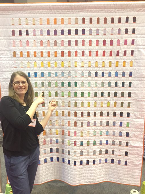 Sheri Cifaldi-Morrill | Whole Circle Studio with her quilt, 270 Colors, designed and made to celebrate the 10th anniversary of Aurifil USA.