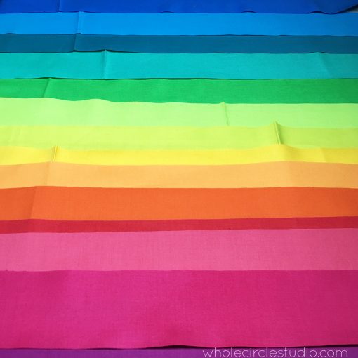 Rainbow fabric strips to be made into binding. Fabric: Cotton Supreme Solids by RJR Fabrics. 