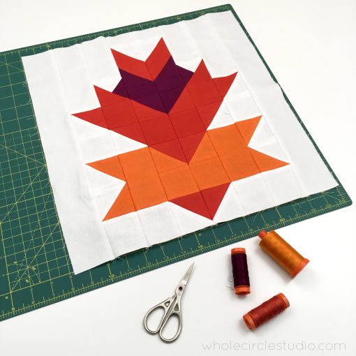 Leaf Peepers Quilt Pattern: Block 4. A modern, graphic spin on the traditional half square triangle. A great PDF pattern to use with solid fabric, prints or batiks! Pattern available at wholecirclestudio.com