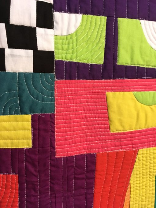 detail of "Crazy Town Roopetoope" by Irene Roderick displayed in the 2018 Modern Quilt Showcase sponsored by the Modern Quilt Guild at the International Quilt Festival in Houston