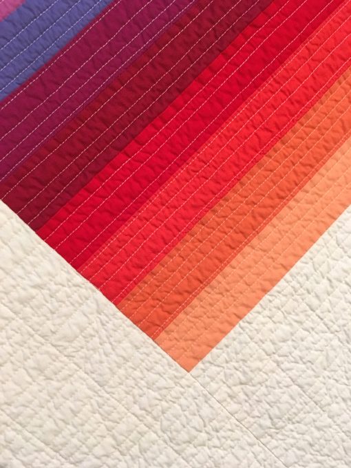 detail of "Color Glide-Summer" by Juli Smith displayed in the 2018 Modern Quilt Showcase sponsored by the Modern Quilt Guild at the International Quilt Festival in Houston