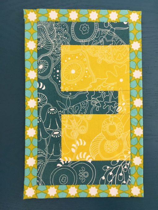 E English Paper Piecing EPP Alphabet Modern Mini Quilt made by Erin Bay, Paper Piecies of Paducah using Alison Glass Sunprint fabric and Typecast EPP pattern.