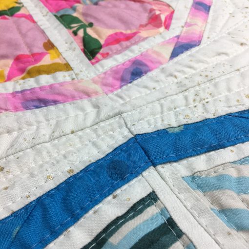 detail of quilting with Aurifil 40wt on Citrus Slices, a fun modern foundation paper piecing quilt pattern. Designed by Sheri Cifaldi-Morrill of Whole Circle Studio