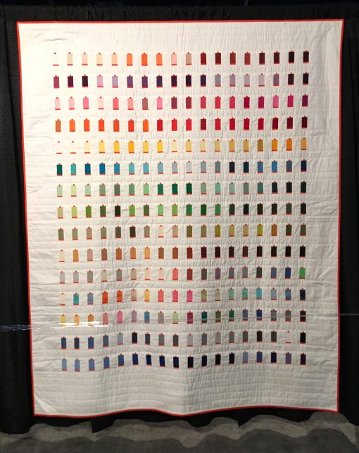 "270 Colors" by Sheri Cifaldi-Morrill Statement: "I designed and created a quilt for the Italian thread company, Aurifil, to commemorate and celebrate their tenth anniversary in the United States. The quilt features all 270 curent colors of Aurifil's 50wt thread" [Design Source: Aurifil 50wt large cotton thread spools | Techniques: Machine pieced and quilted]