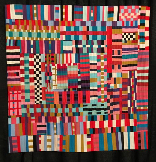 "Good Vibrations" by Kristin Shields Statement: "This quilt represents the pure joy of playing with color, rhythm, and pattern. Improvisational piecing is all about saying yes to the possibilities." [Design Source: Original Design | Techniques: Machine pieced and quilted] displayed in the 2019 Modern Quilt Showcase sponsored by the Modern Quilt Guild at the International Quilt Festival in Houston