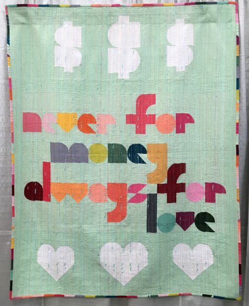 “Naive” by Laura Hartrich @laurahartrich Statement: “Words from a favorite song, and an unofficial, cheeky motto for my quilt making. Quilters know that people are constantly asking if you sell your quilts, and then reacting with shock when you name a price. Here is another possible way to answer. I think it’s more polite than, ‘You can’t afford me.’” Modern quilt featured in the Handwork category at QuiltCon 2020 in Austin, Texas presented by the Modern Quilt Guild.