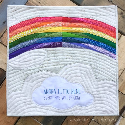 Andrà Tutto Bene (Everything Will Be Okay in English) is a free foundation paper piecing pattern (FPP) and was inspired by the words and beautiful artwork created by children in Italy during the Covid19 pandemic in 2020. While children and their families in Italy were quarantined in their homes, many displayed rainbow-themed banners and posters featuring the phrase "Andrà Tutto Bene" to send messages of hope and positivity. We encourage you to make this mini quilt to display in the window of your own home or sewing space. Make one for yourself, for a friend, or even for your local quilt shop. Share hope.