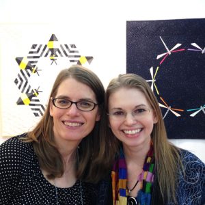 Sheri Cifaldi-Morrill and Leah Day in Whole Circle Studio's booth: Fall Quilt Market 2016