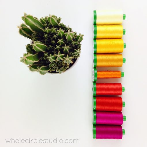 Beautiful gradient of Aurifil thread colors | photo by wholecirclestudio.com