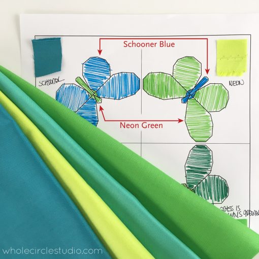 Color and fabric selection on my Butterfly Bunch coloring sheet. I used RJR Cotton Supreme solid fabric in blues and greens to make this mini quilt. 