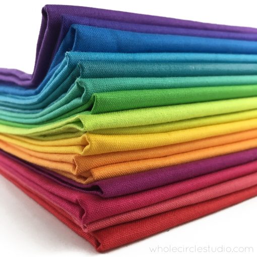 A beautiful rainbow color palette of Cotton Supreme Solids by RJR Fabrics. Ready for quilting! Curated by Sheri Cifaldi-Morrill.