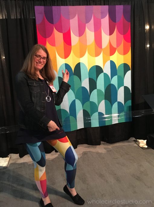 When you're wearing pants that match your quilt that is hanging on exhibit at International Quilt Festival... Kona Sunset leggings designed by Sheri Cifaldi-Morrill of Whole Circle Studio exclusively for Makers' Mercantile. Looks like a modern quilt with texture, but they're actually made of a 4-way stretch polyester/spandex blend that conforms to your body in every direction. Perfect for yoga class, a night out on the town or just making a bold statement!