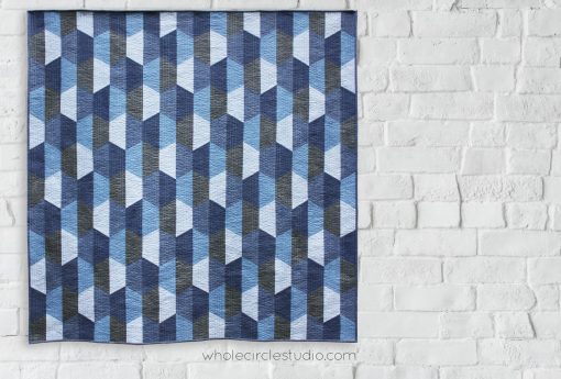 Hexie Blues is an easy, modern quilt pattern. No complicated Y-seams necessary! This super versatile pattern looks great in blues or your favorite color palette—go with a monochromatic, rainbow or even scrappy color palette. A coloring sheet is included so you can audition all types of fun combinations! Make a throw quilt (featured in pattern) or adjust the block layout to make table runners, pillows or larger quilts. You’ll want to make this pattern over and over again! Pattern available at www.wholecirclestudio.com