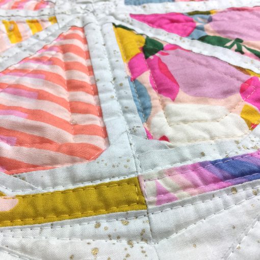detail of quilting with Aurifil 40wt on Citrus Slices, a fun modern foundation paper piecing quilt pattern. Designed by Sheri Cifaldi-Morrill of Whole Circle Studio