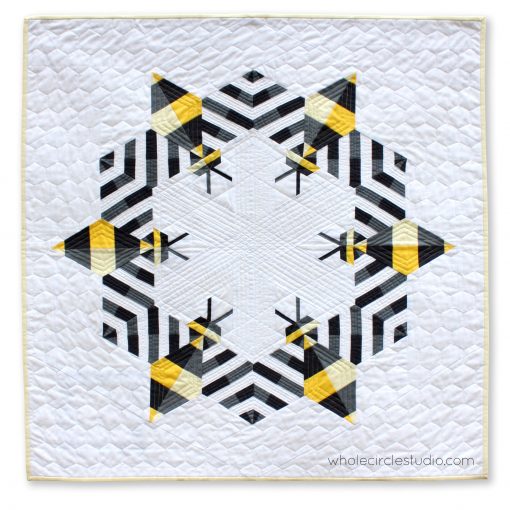 Bzzzzzz is an award-winning modern, graphic wallhanging/mini quilt featuring a combination of traditional machine piecing and foundation paper piecing. Make additional blocks to make a larger quilt (layout ideas are provided to make a lap, twin or queen quilt). This tested pattern contains both detailed instructions and diagrams, making it easy to piece.