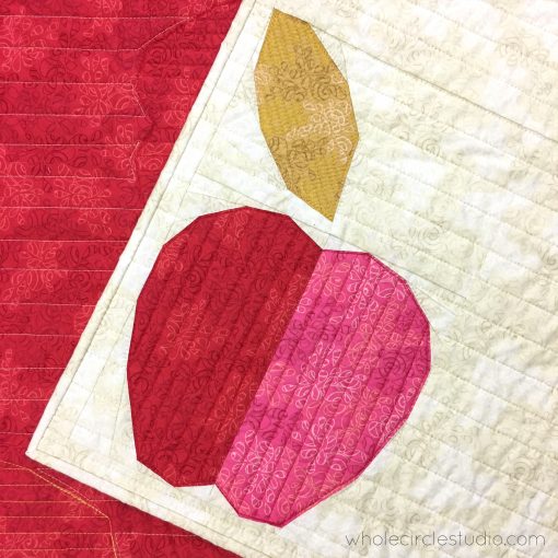 Apple Turnover, a fun modern foundation paper piecing quilt pattern. An easy pattern—instructions included for four sizes: mini, wall, runner, and throw. Designed by Sheri Cifaldi-Morrill of Whole Circle Studio