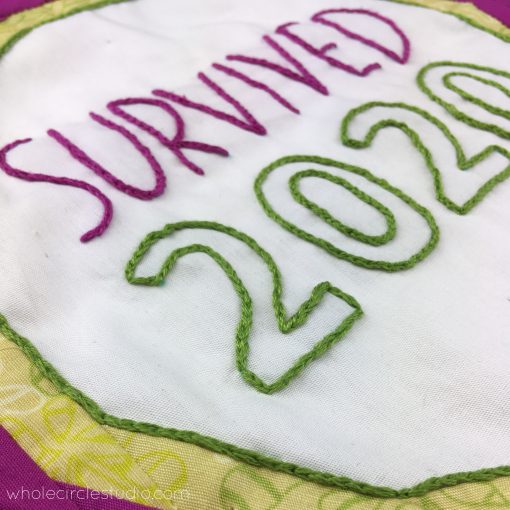 Survived 2020, embroidery by Sheri Cifaldi-Morrill. Quilt block pattern is Best in Show by whole circle studio.