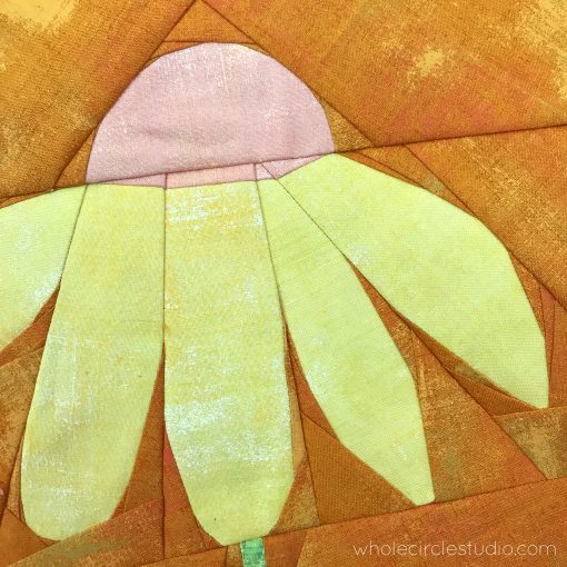 detail of Block 4 (cone flower or daisy) for the Botanical Beauties Block of the Month (BOM)—grid version quilt block. Made with Grunge by Moda Fabrics: Peach Nector, Lemon Drop, Key Lime, and Butterscotch