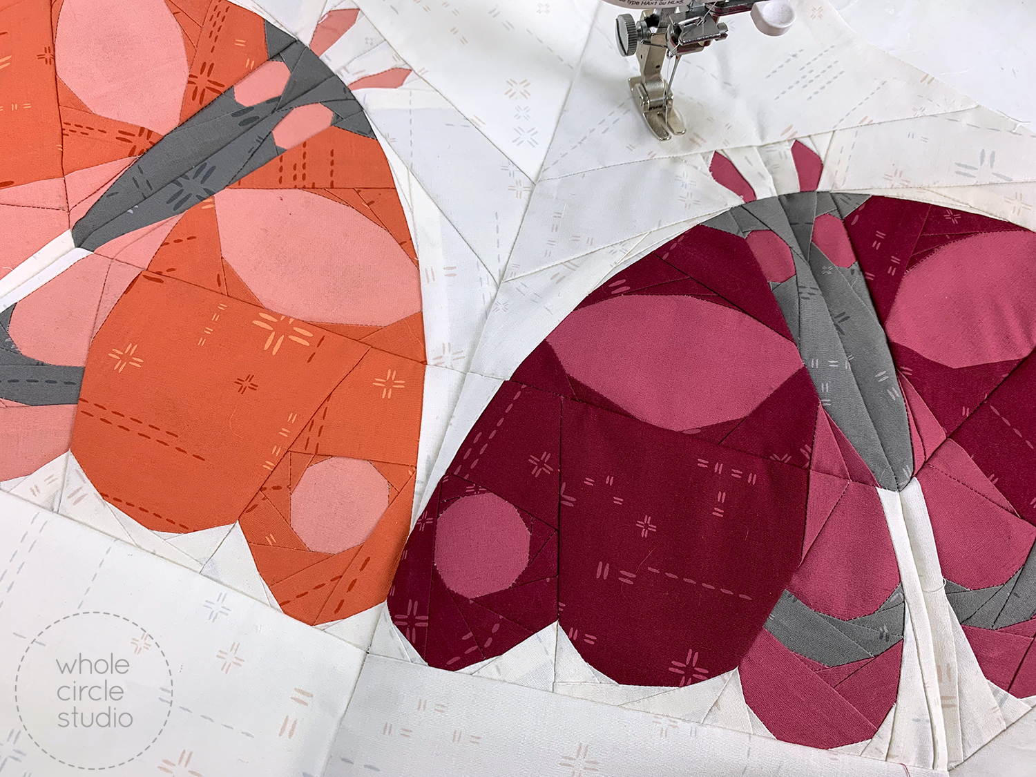 two quilt blocks of moths