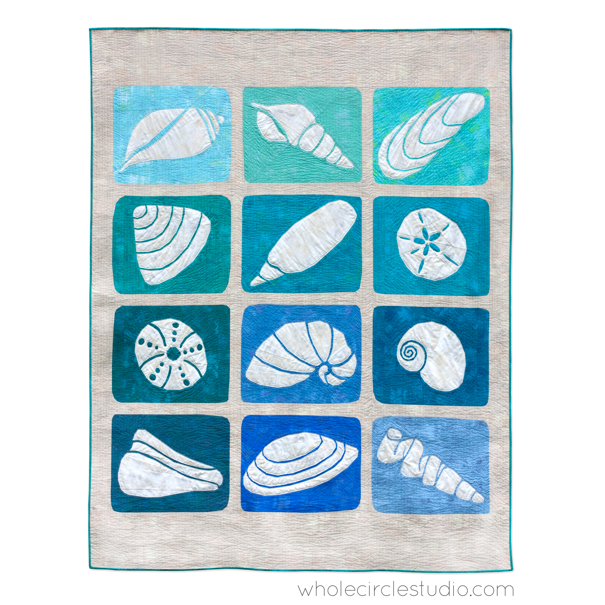 quilt with 12 blocks that look like sea shells