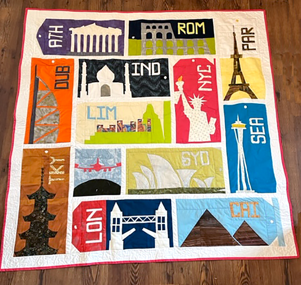 quilt with architectural structures from around the world
