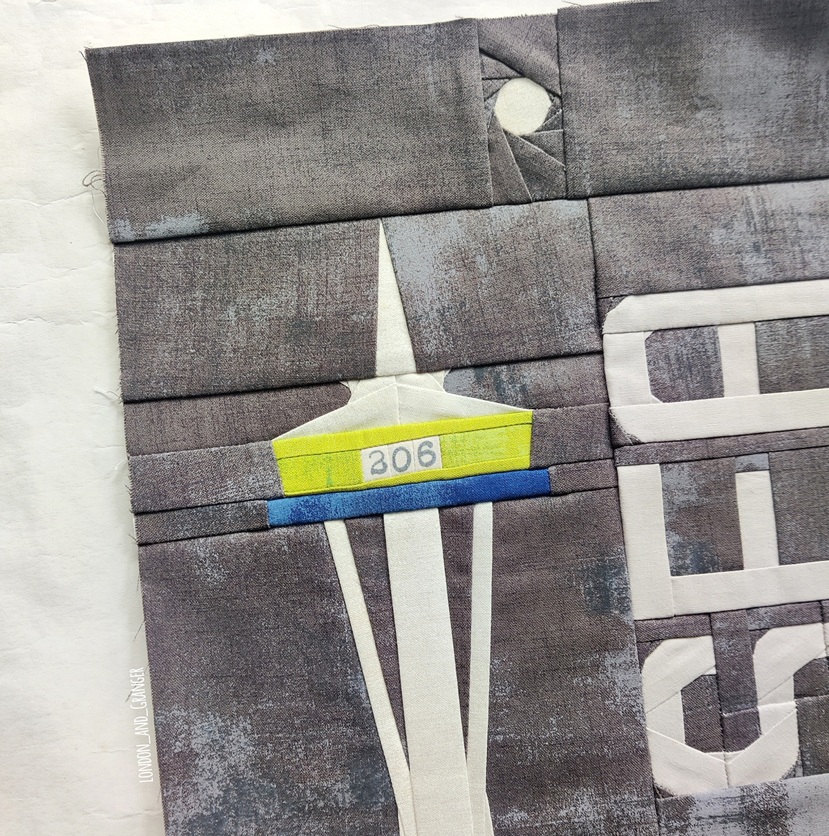 detail of a Quilt Block that looks like the Seattle Space Needle. 
