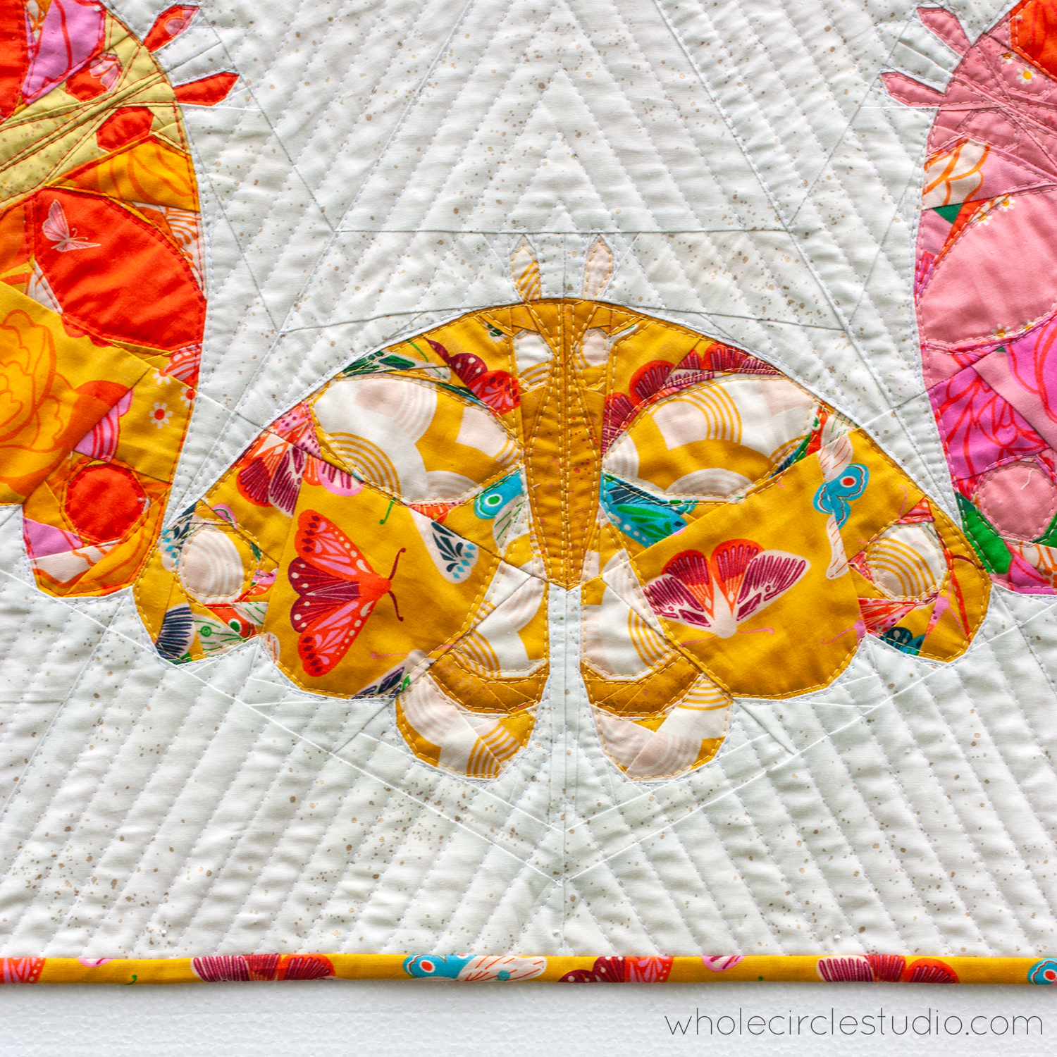 detail of quilt block that looks like a moth