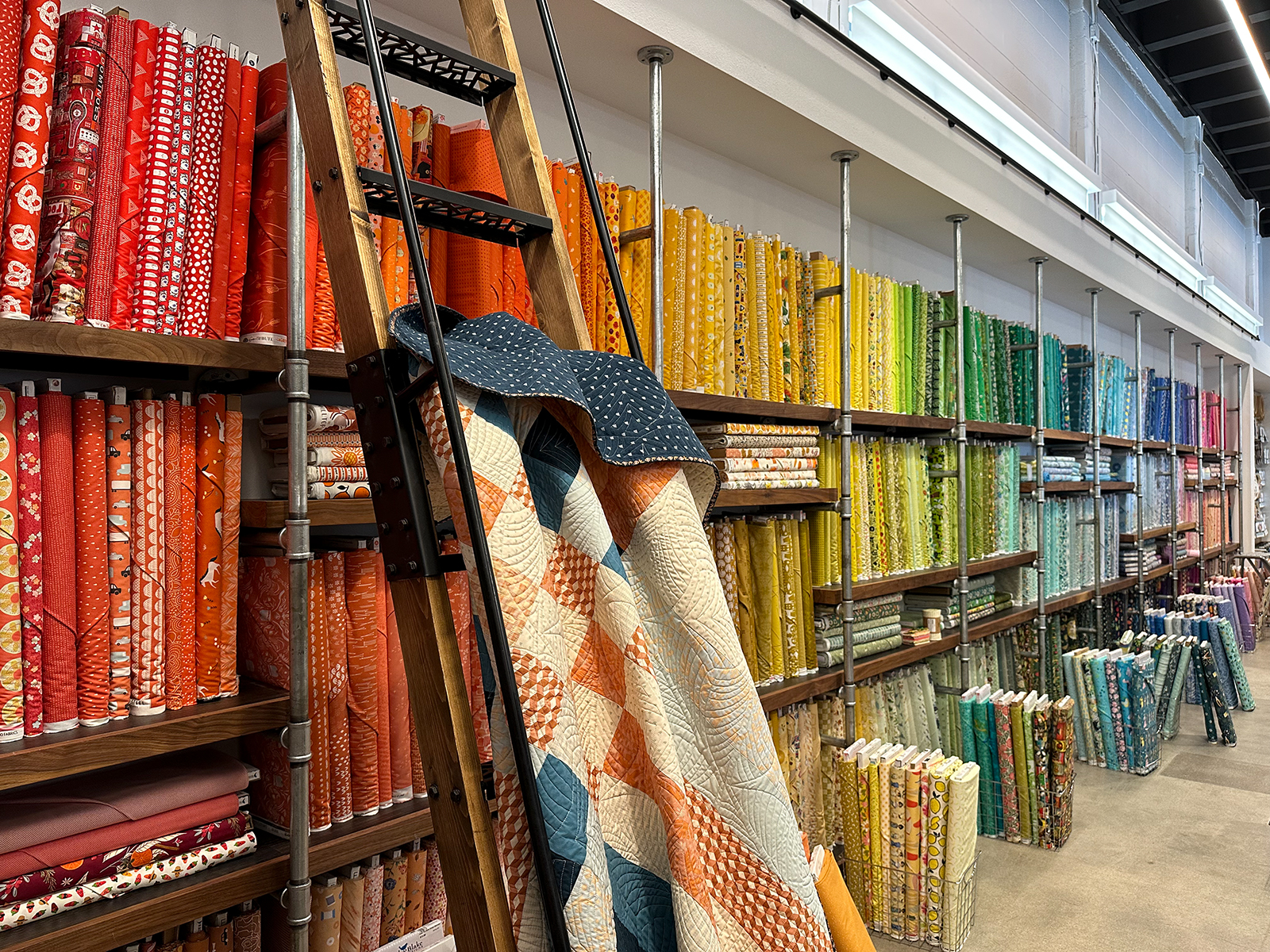 wall of an interior of a fabric store with colorful fabric