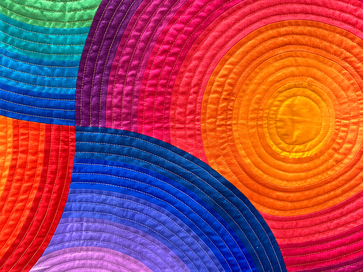 detail of a colorful quilt