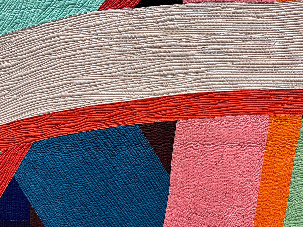 detail of colorful quilt