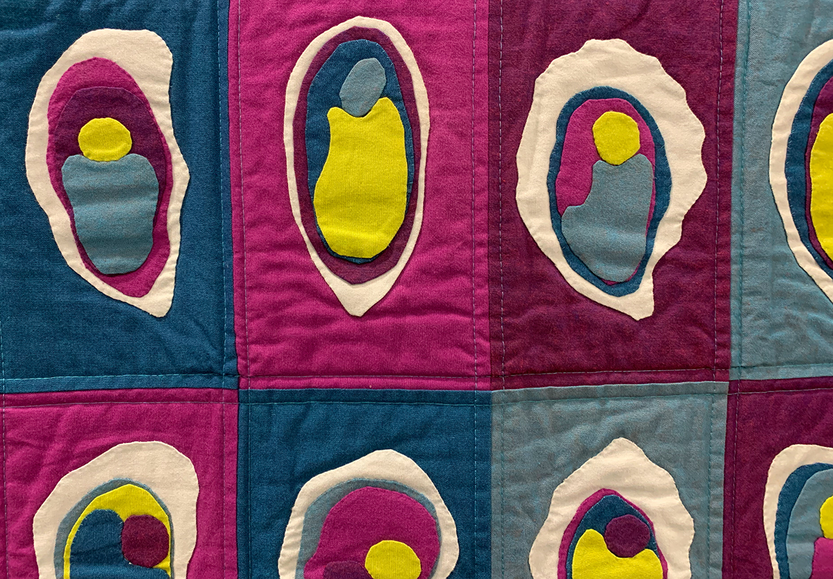 detail of quilt that looks like oysters