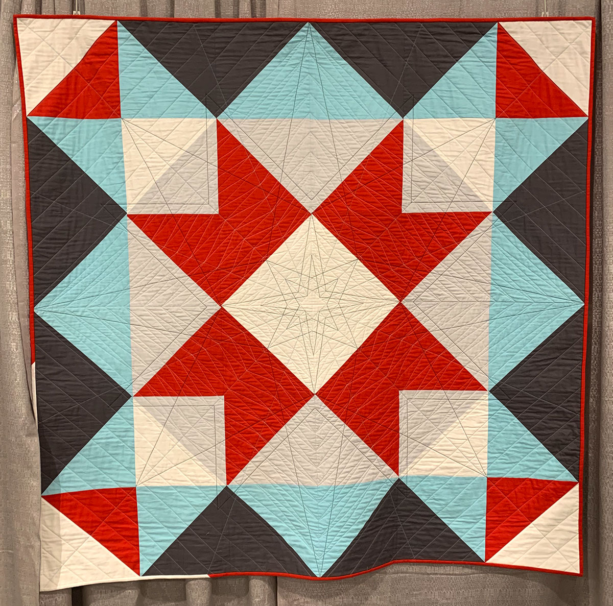 geometric quilt, blue, red and white