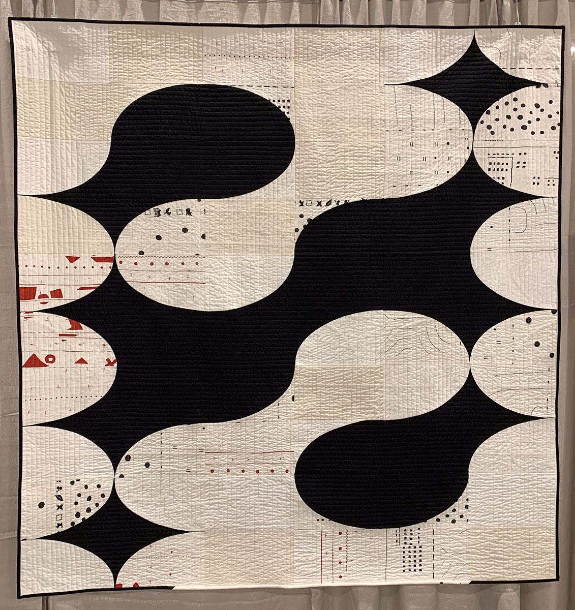 abstract quilt, black and white with red