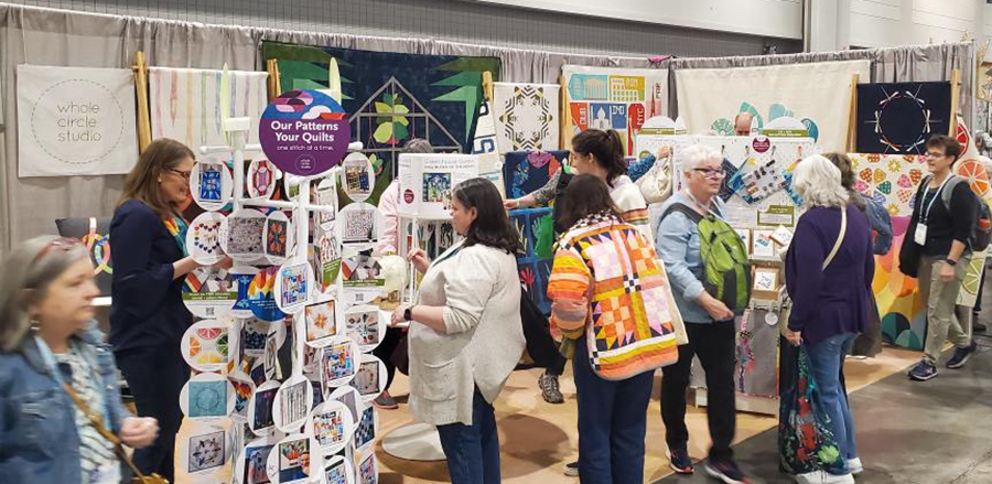 crowded trade show booth at a quilt show