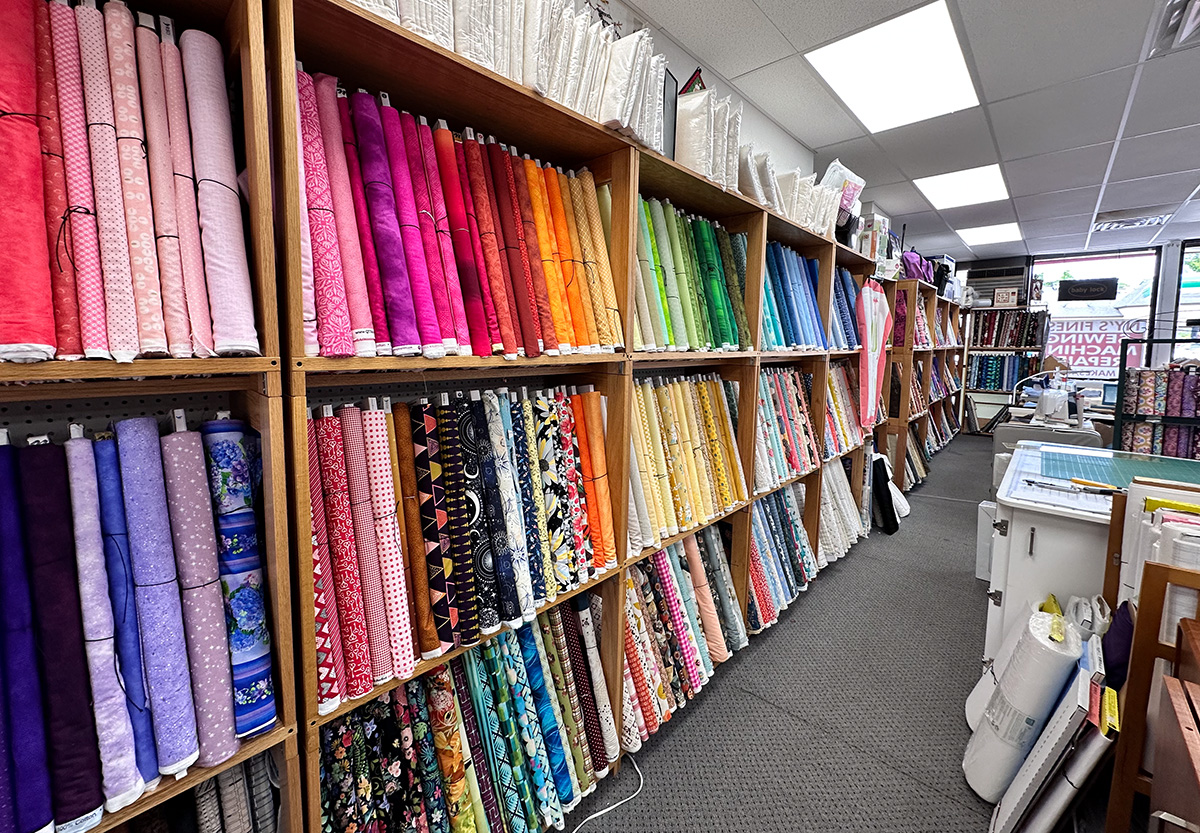 a wall of colorful fabric at a local business