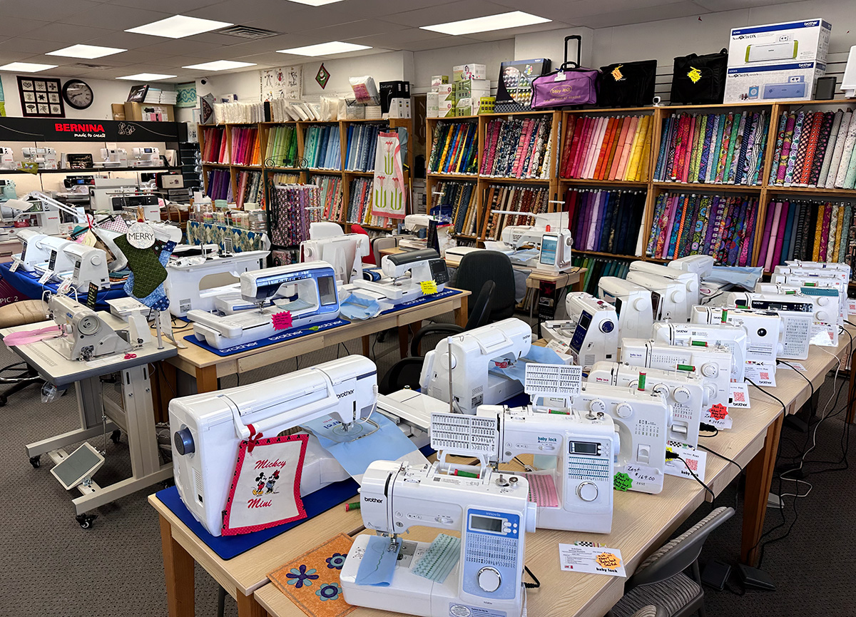 sewing machines and fabric on display at a sewing/quilting shop