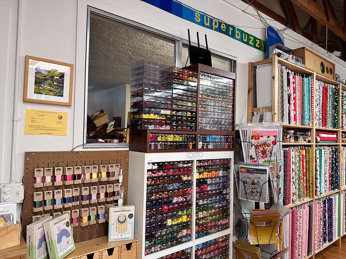 embroidery supplies shelves in a quilt shop