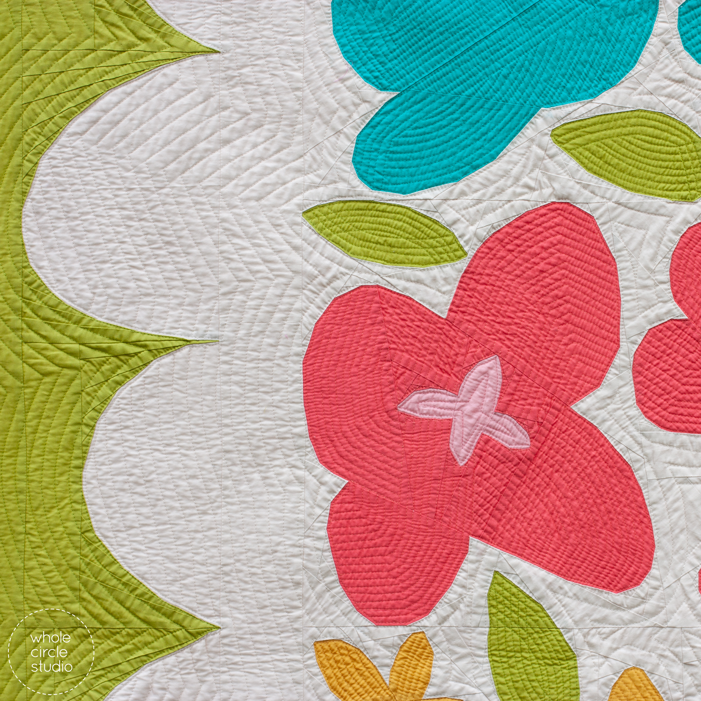 Close up of bright, foundation paper pieced flower quilt.