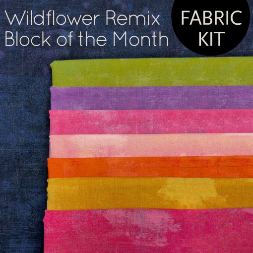 stack of colorful fabric for a quilt kit