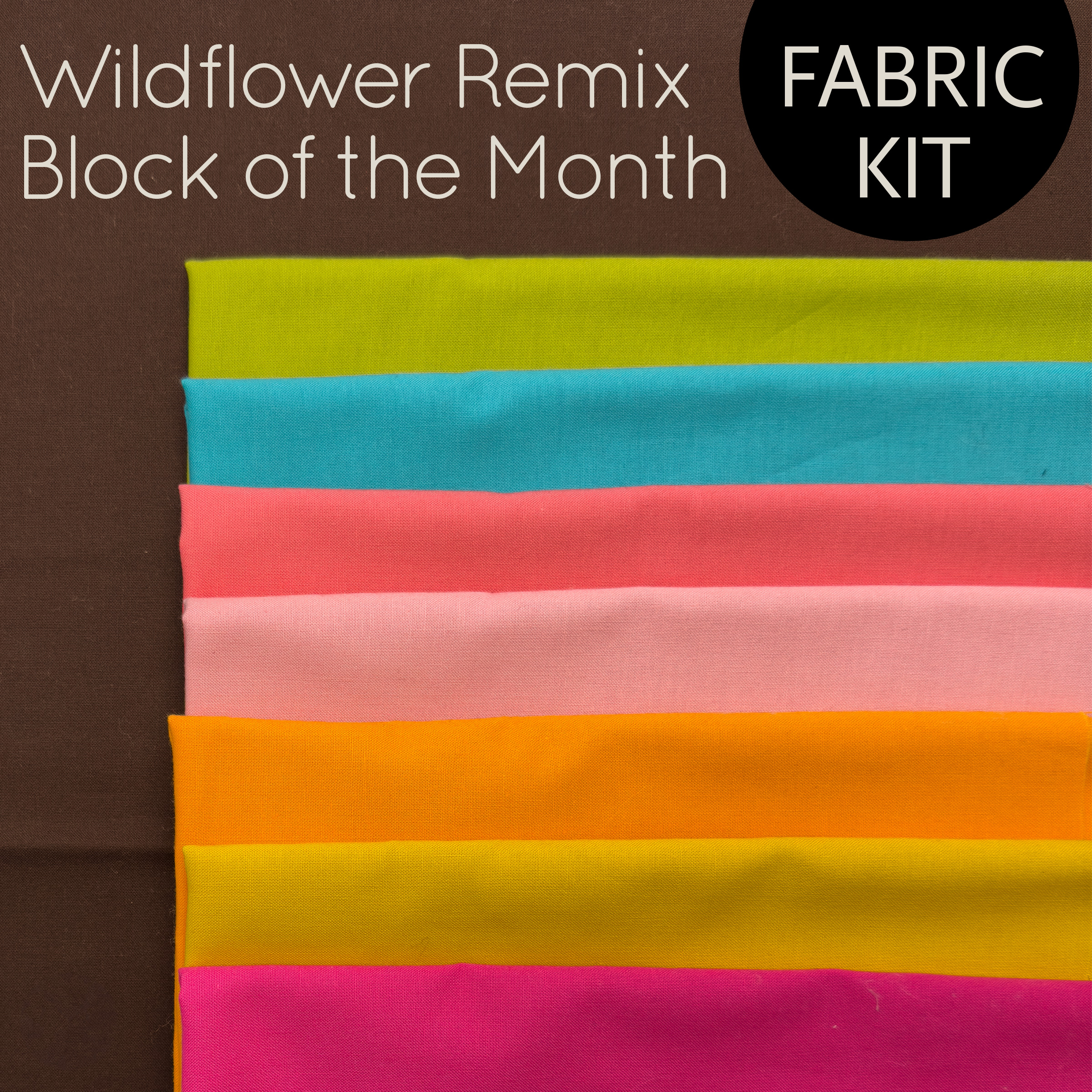 stack of colorful fabric for a quilt kit