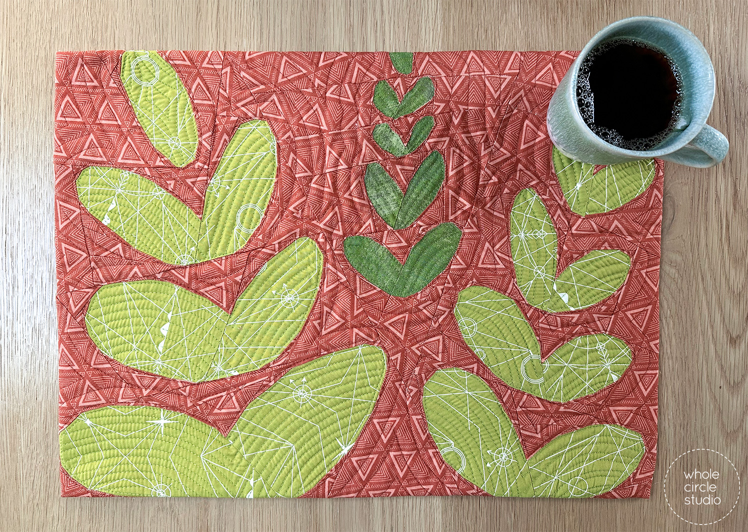 Wildflower Remix placemat made from one foundation paper pieced flower block using scrappy stash fabrics.