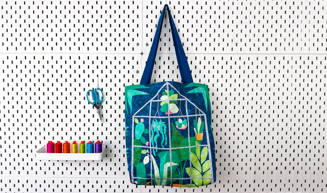 plant themed tote bag hanging on pegboard