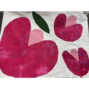 textured pink flower quilt block