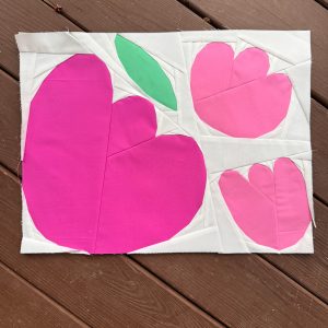 floral foundation paper pieced block made with pink, green, and white fabric