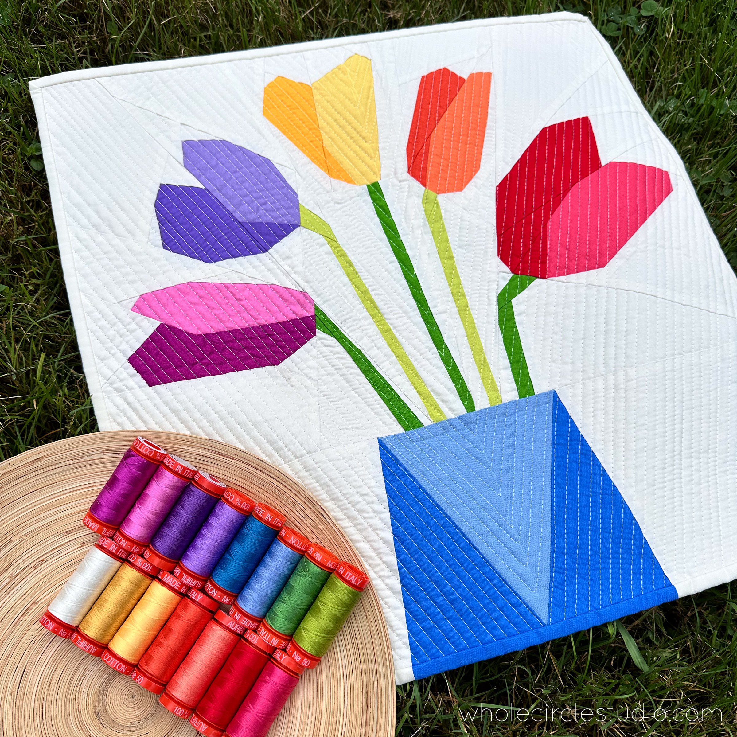 Modern tulip quilt with coordinating Aurifil thread collection