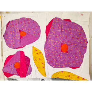 3 abstract flowers and 2 leaves quilt block