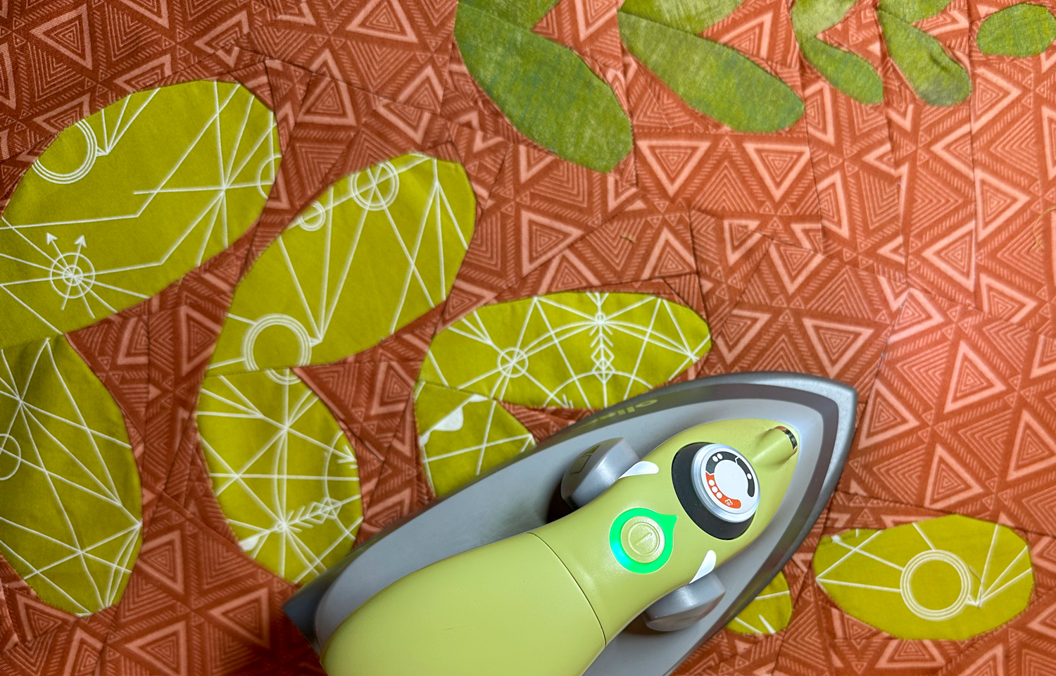 Pressing a paper pieced quilt with a mini iron